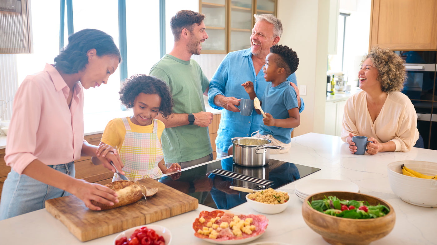Family gathering centred around the kitchen with appliances