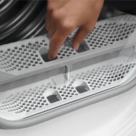 AEG TR718L2B 7000 8KG SensiDry® Heat Pump Tumble Dryer in White - A++ Rated Stock Photo fluff filter