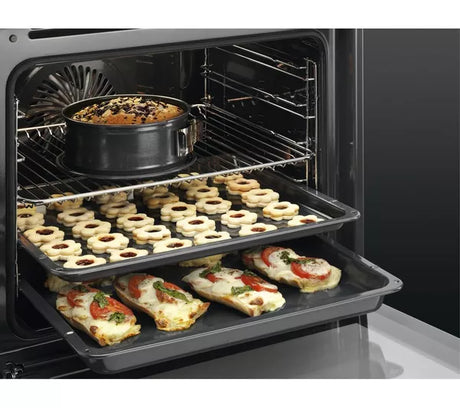 AEG BEX335011B SurroundCook Built-In Electric Single Oven in Black - A Rated stock photo oven baking on 3 levels